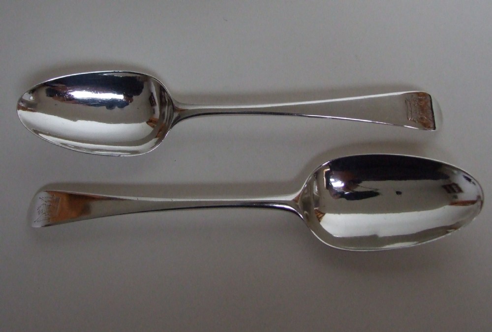 A fabulous pair of mid 18th Century silver serving spoons.