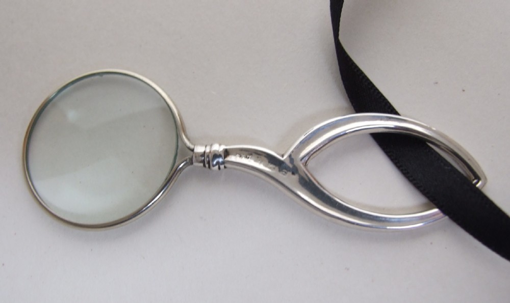A gorgeous Edwardian silver pendant magnifying glass.