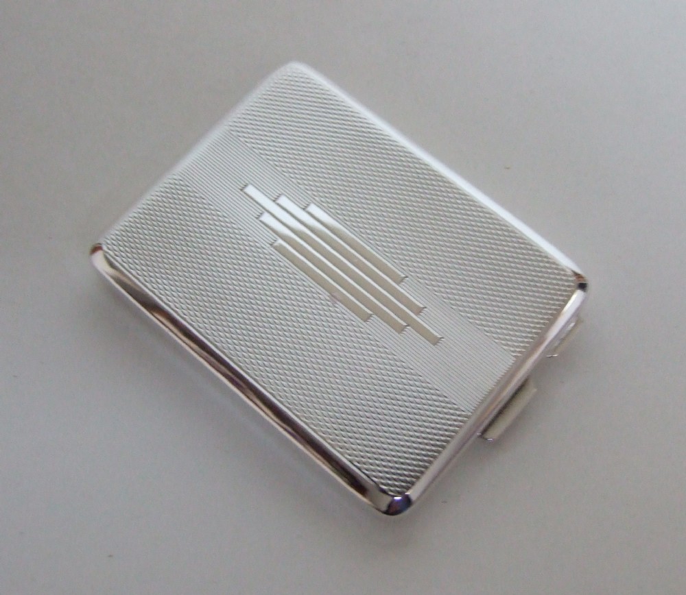 A fabulous Art Deco silver match book holder..