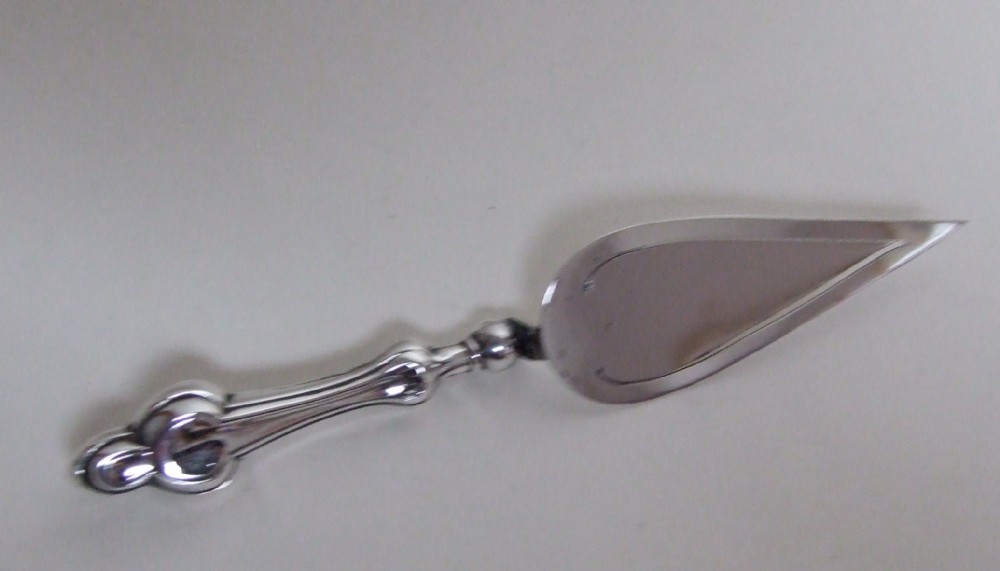 A larger than usual silver trowel bookmark.