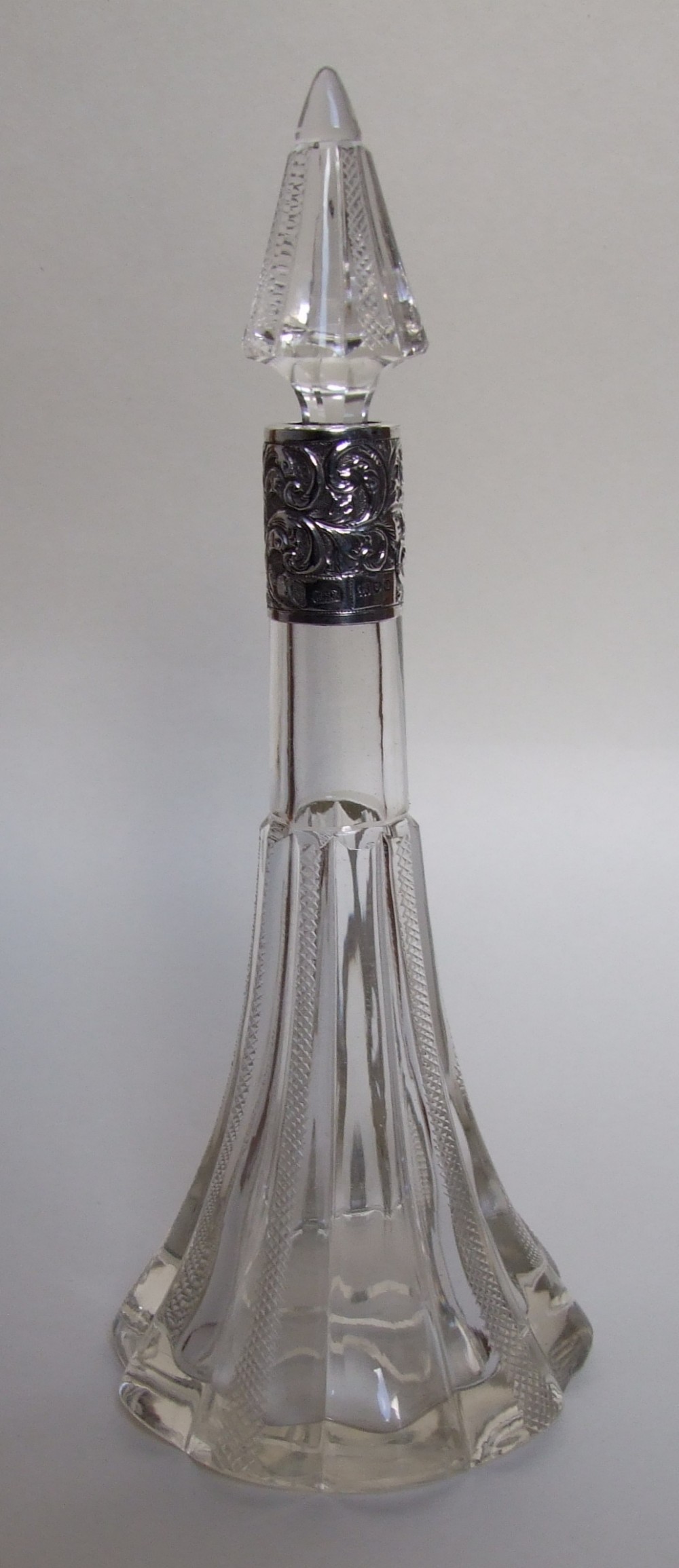 A gorgeous Victorian silver mounted cologne bottle.