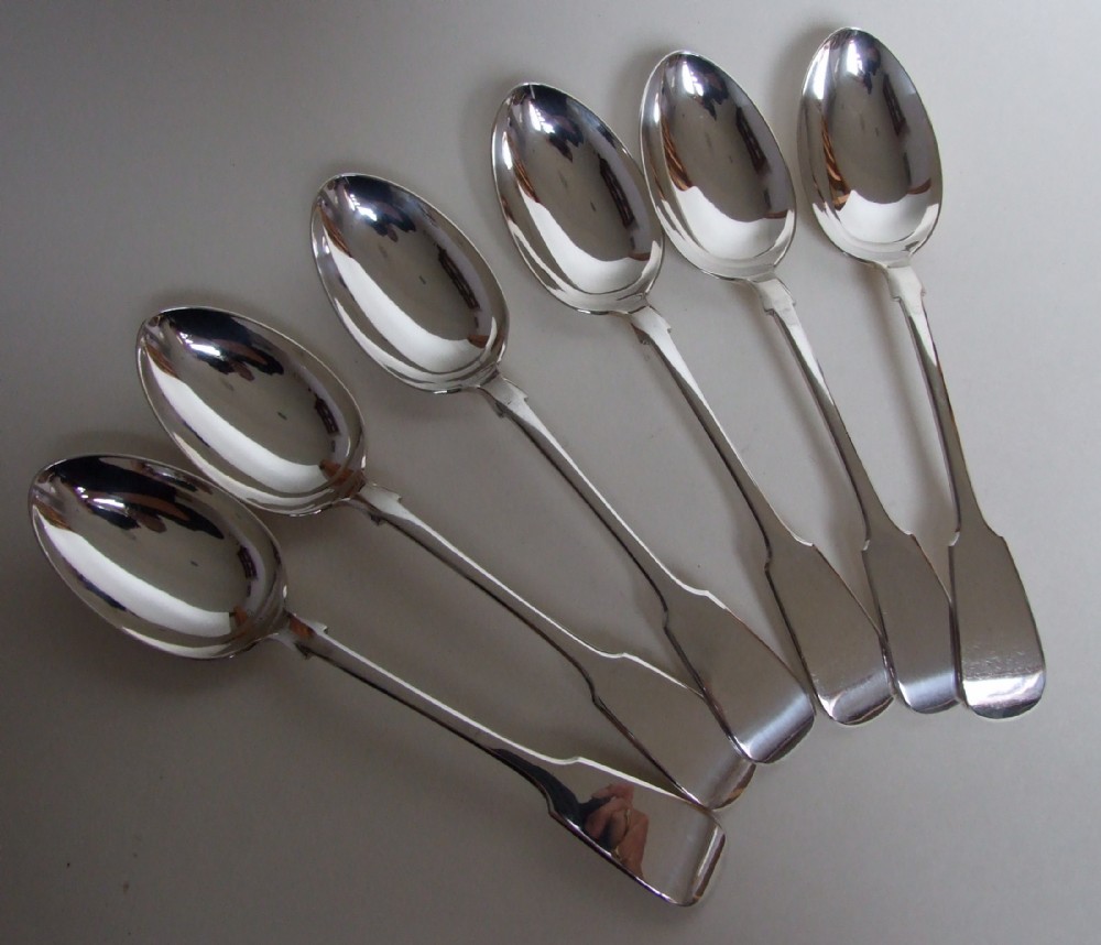 A splendid set of six matching Victorian silver serving spoons.