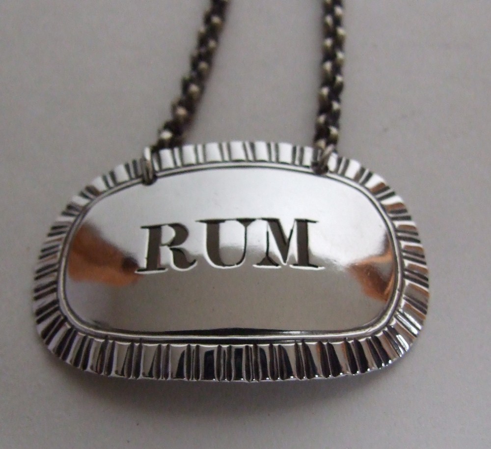 An attractive William IV silver 'Rum' label.