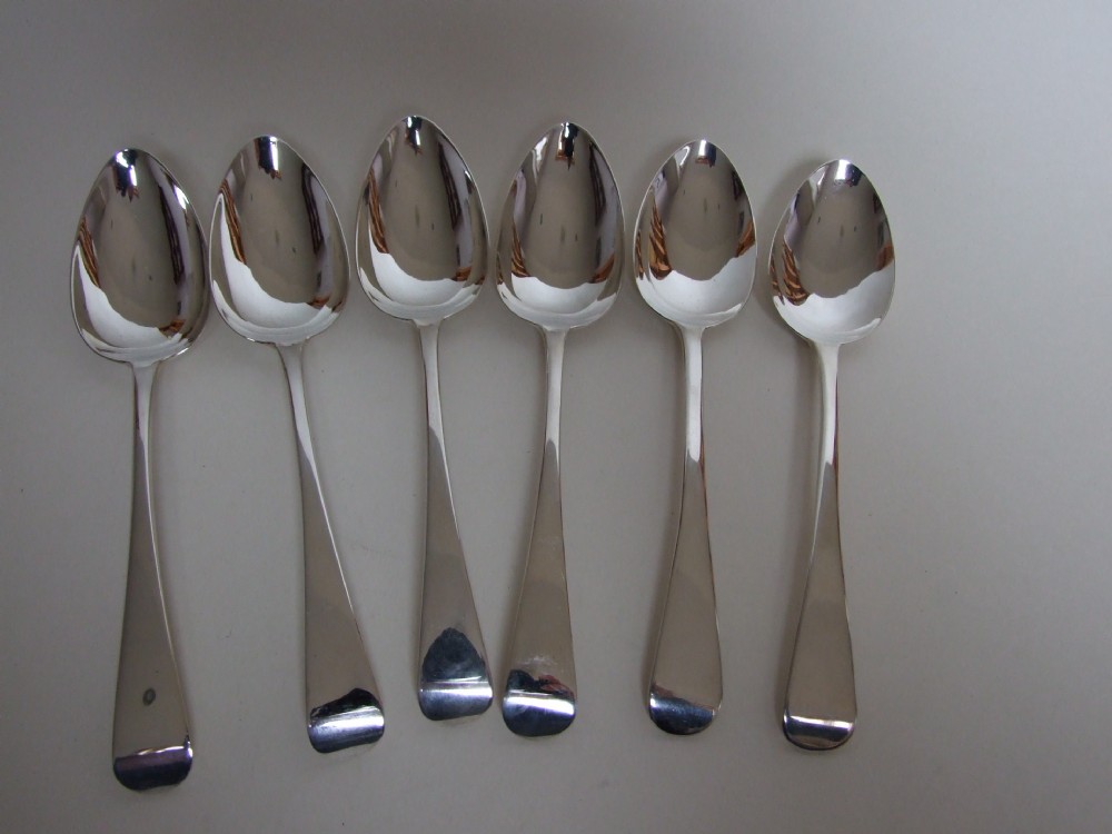 Six Georgian silver dessert spoons.