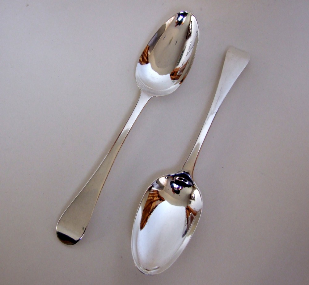 A rare pair of George II silver serving spoons.