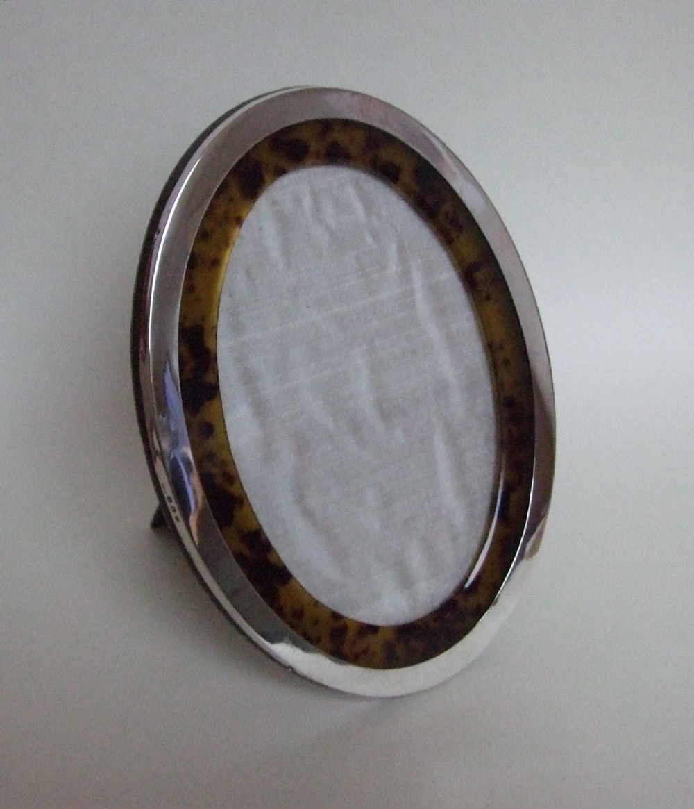 A superb silver & tortoiseshell oval photo frame.