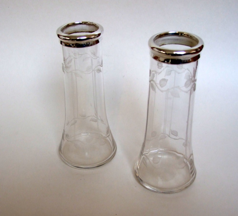 A charming pair of silver mounted Art Nouveau vases.