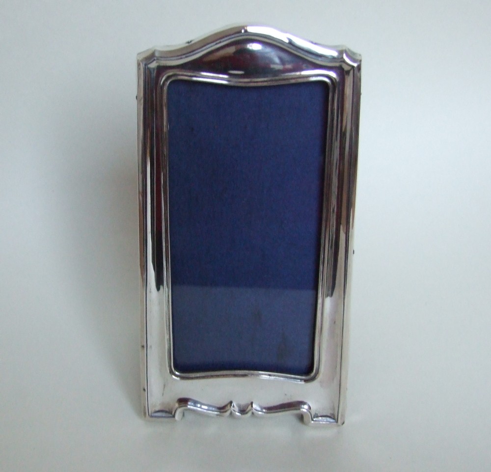 A tall rectangular silver photo frame.