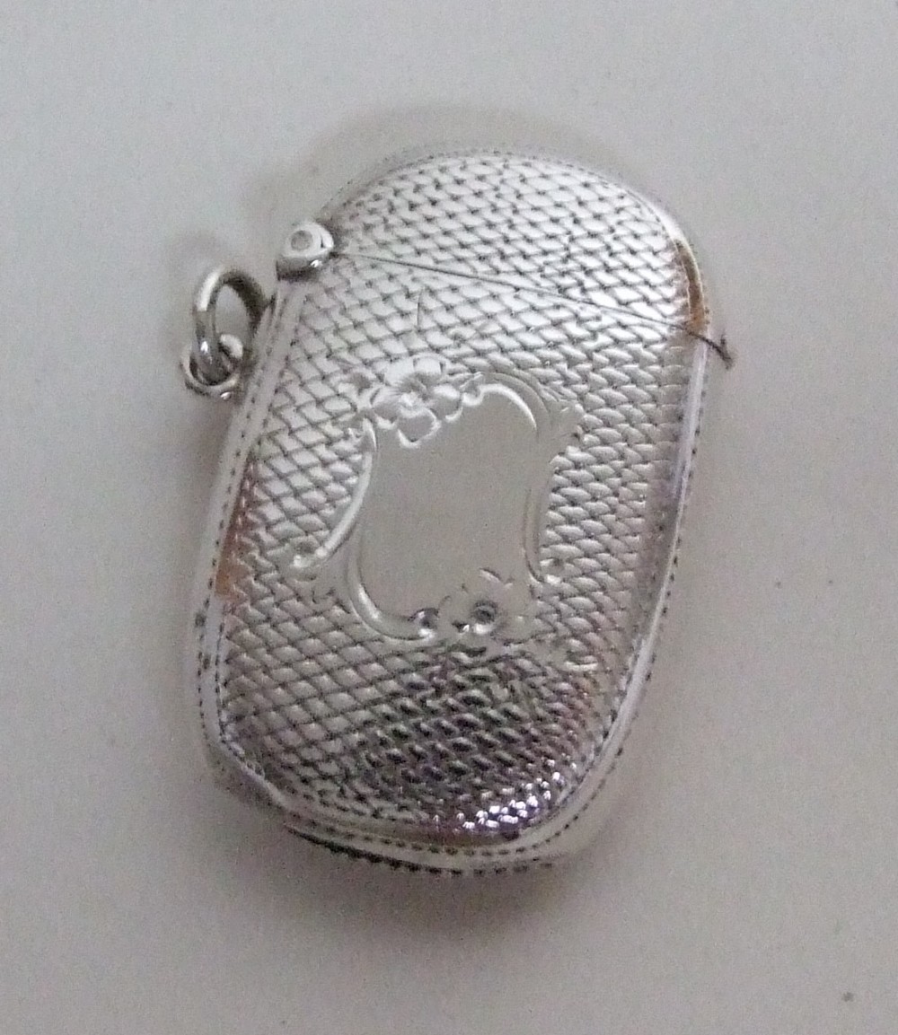 A lovely Edwardian silver vesta of cushion form.