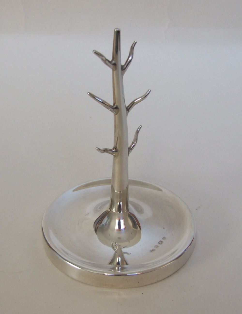 An attractive George V large silver ring tree.