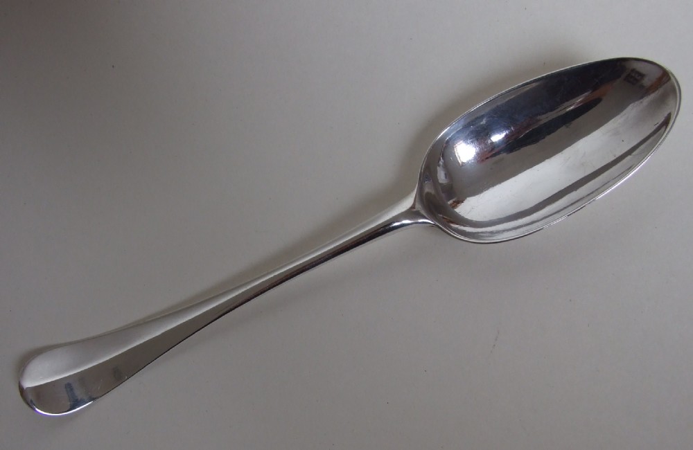 A superb George II silver serving spoon.
