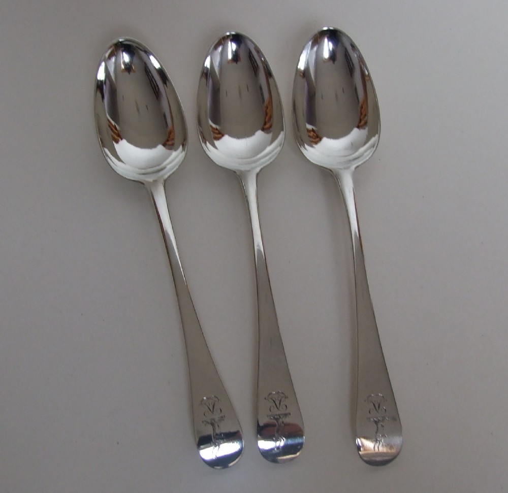 A rare set of three 18th Century silver dessert spoons.