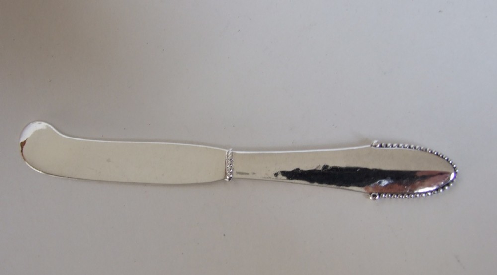 A superb Arts & Crafts Georg Jensen silver butterknife.