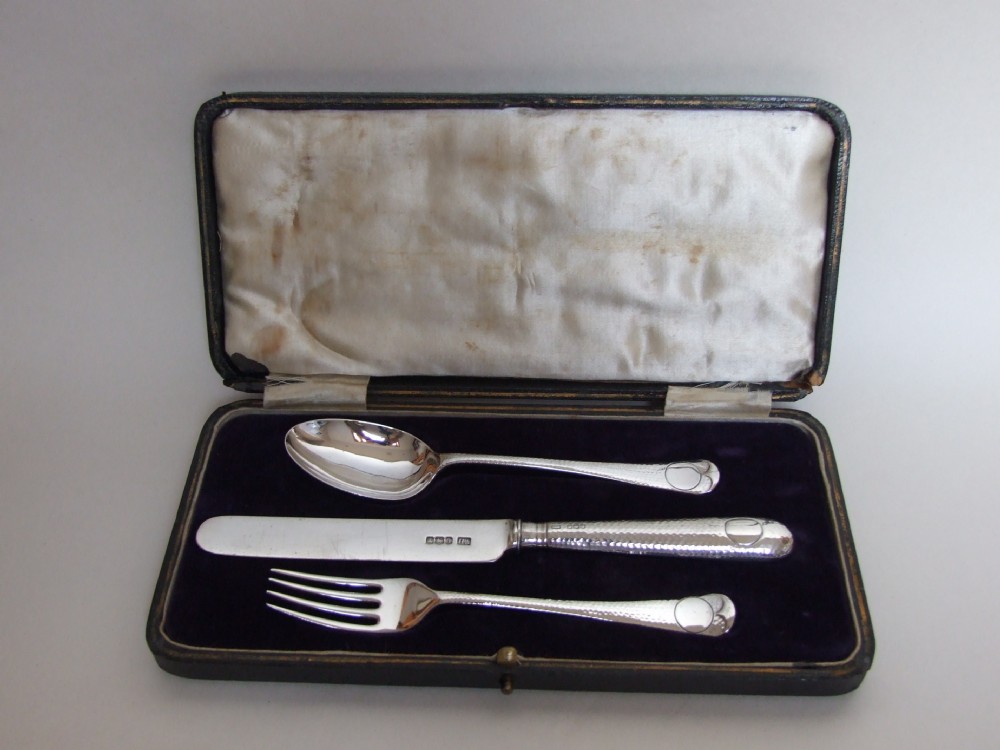 A handsome Arts & Crafts silver boxed Christening set.