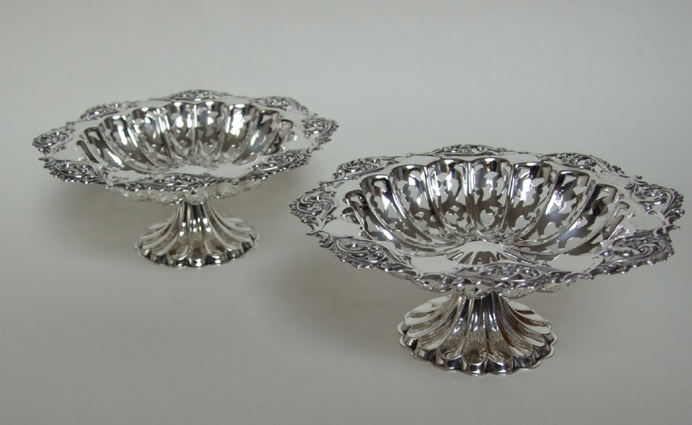 A fabulous pair of Chester silver pedestal sweetmeat dishes.