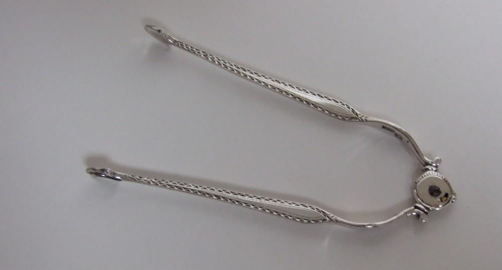A rare pair of mid 18th Century silver tongs.