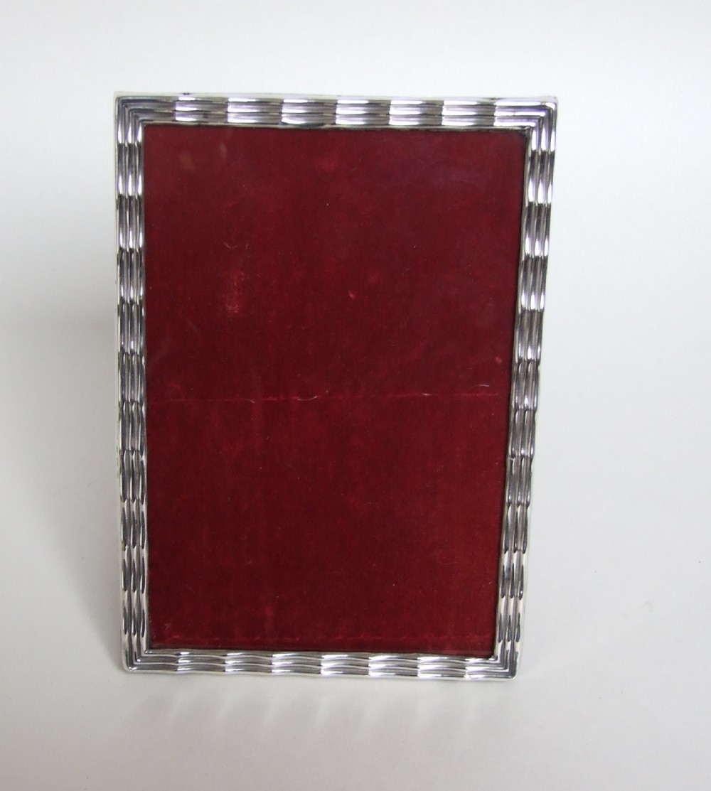 A useful and attractive George V silver photo frame.
