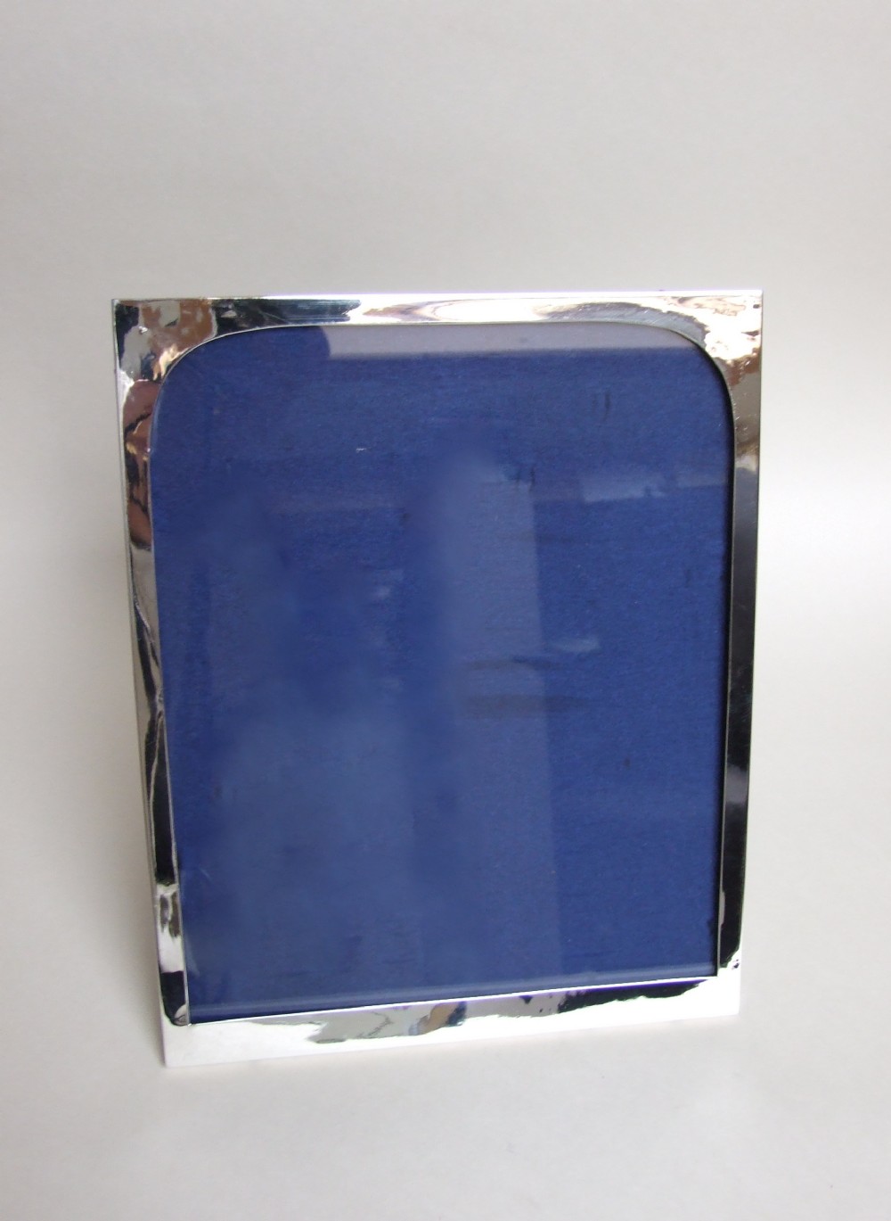 A large and handsome George V silver photo frame.