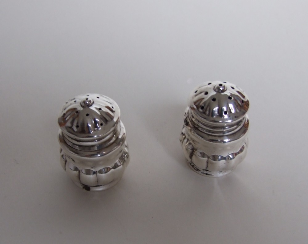 A charming pair of German silver salt & pepper pots.