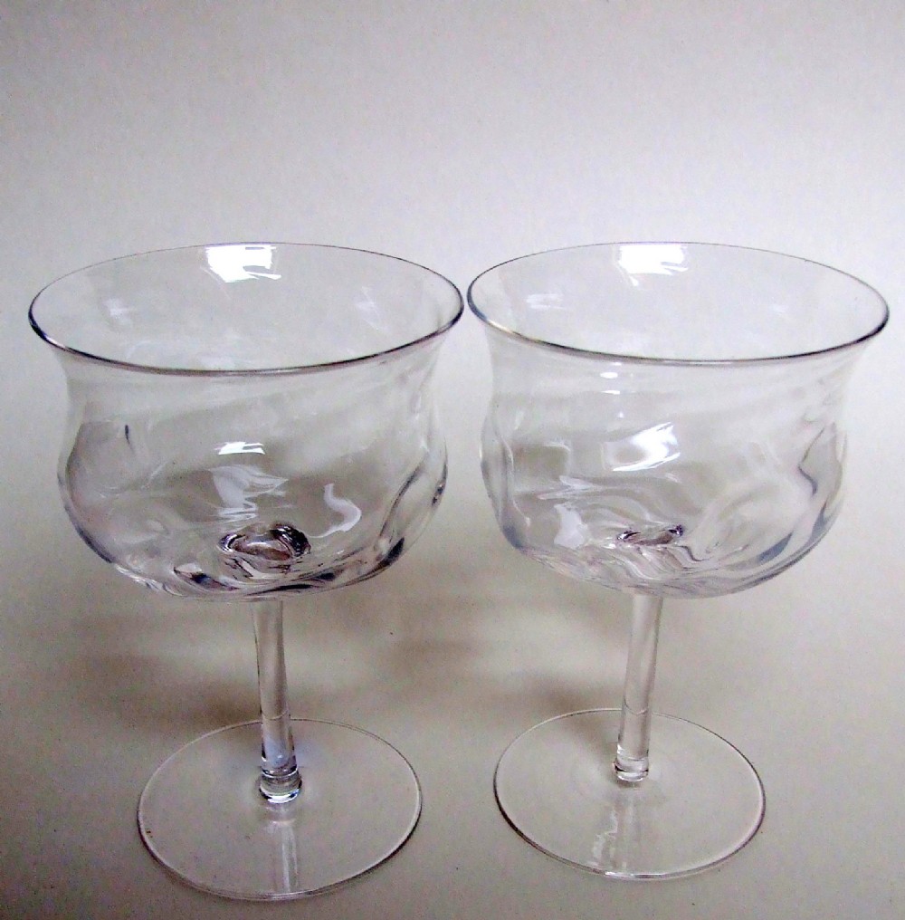 A charming pair of Edwardian wrythen champagne bowls.