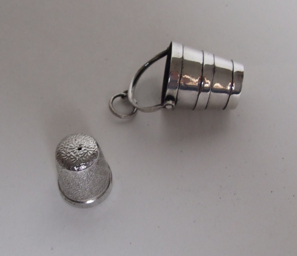 A rare mid Victorian silver thimble holder and thimble.