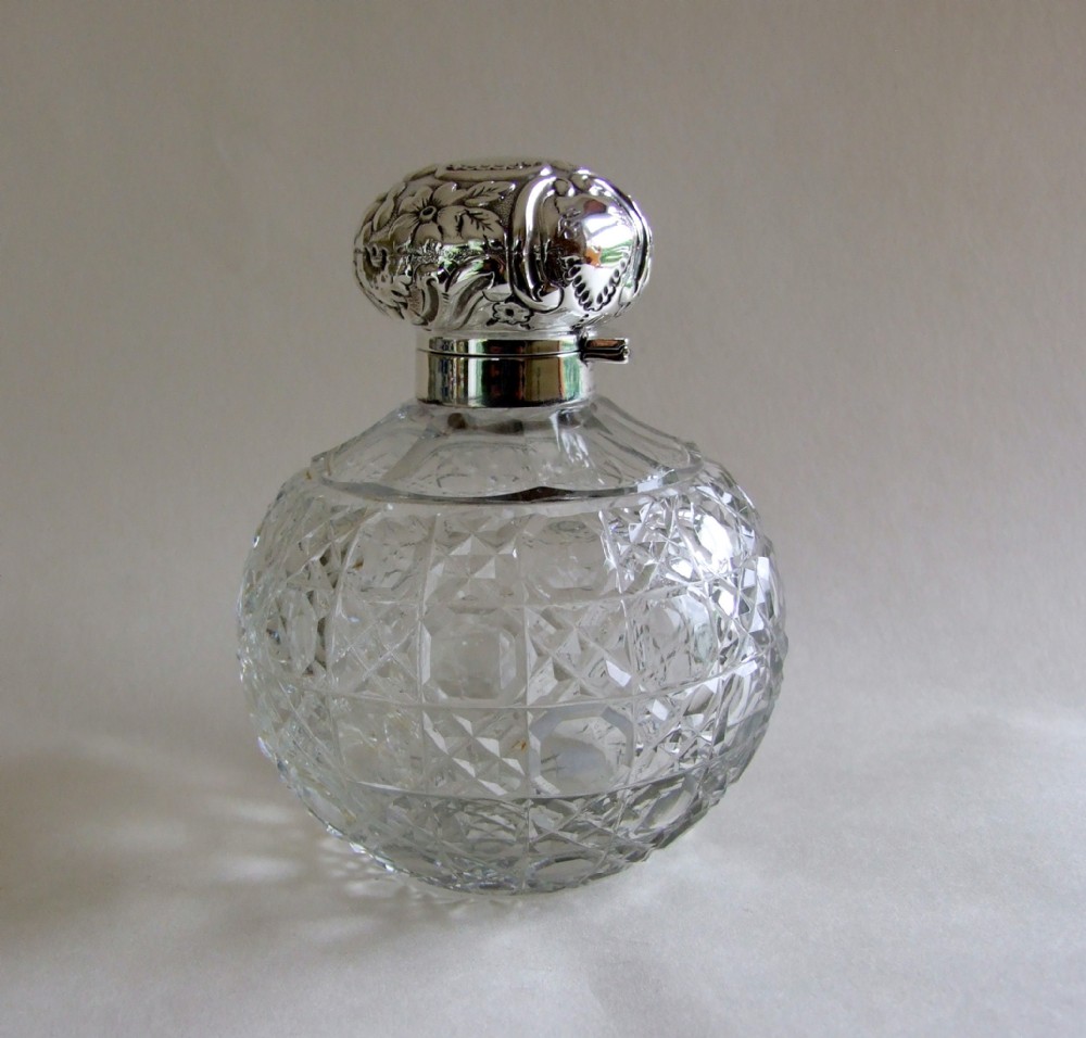 A gorgeous silver mounted Edwardian cologne bottle.