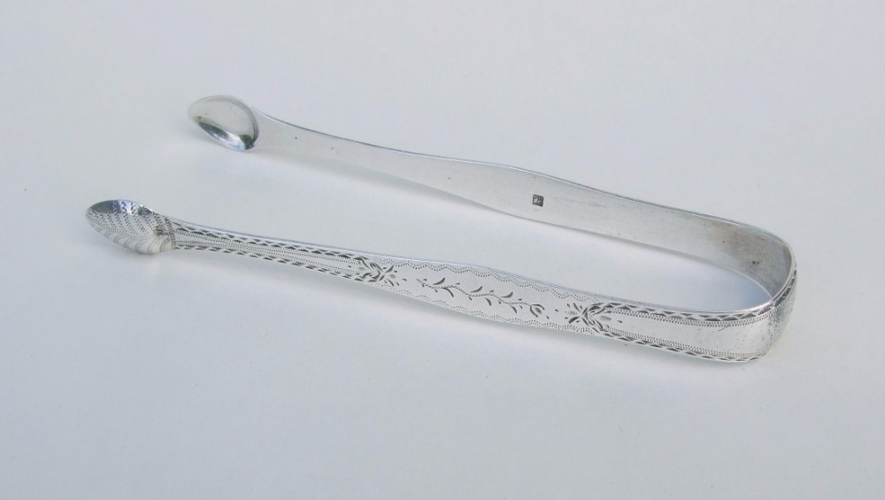 A gorgeous pair of 18th Century silver tongs.