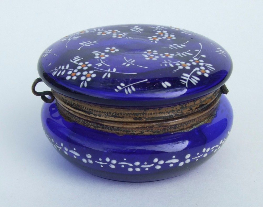 A charming Bristol Blue glass trinket pot with enamel decoration.