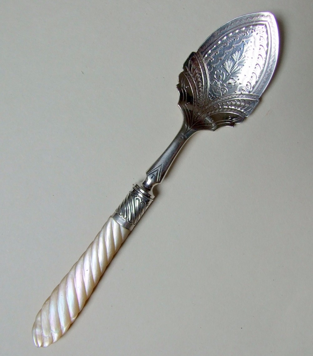 A superb Victorian silver and mother-of-pearl preserve spoon.