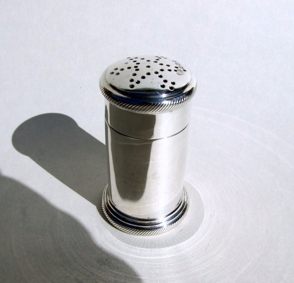 A handsome Art Deco silver pepper pot.