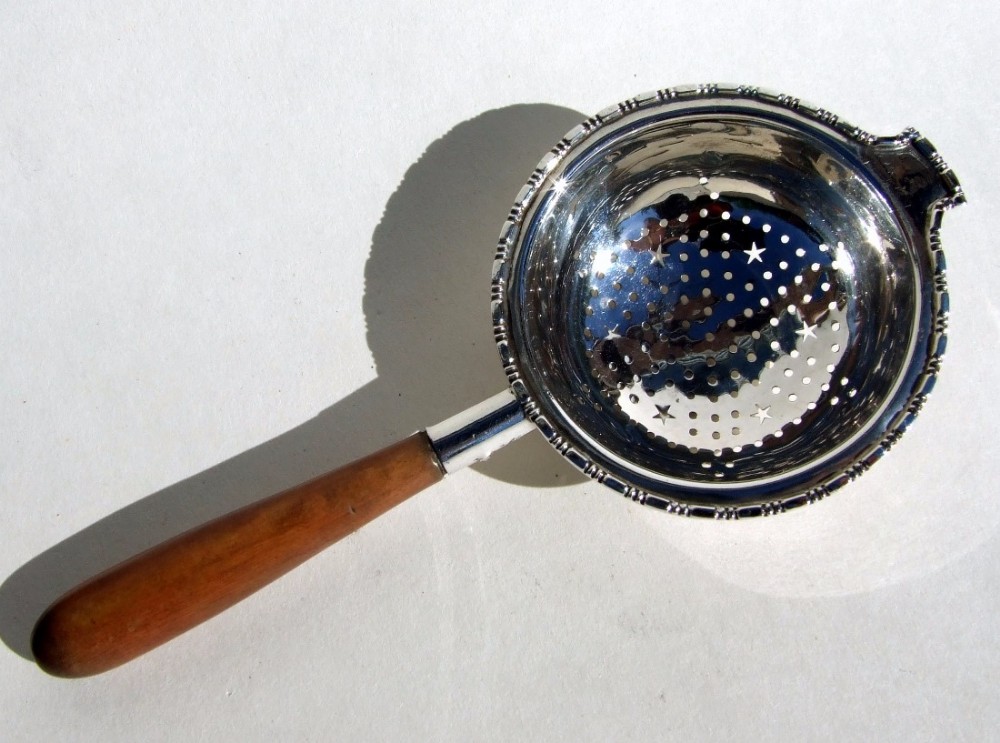 A gorgeous silver tea strainer.