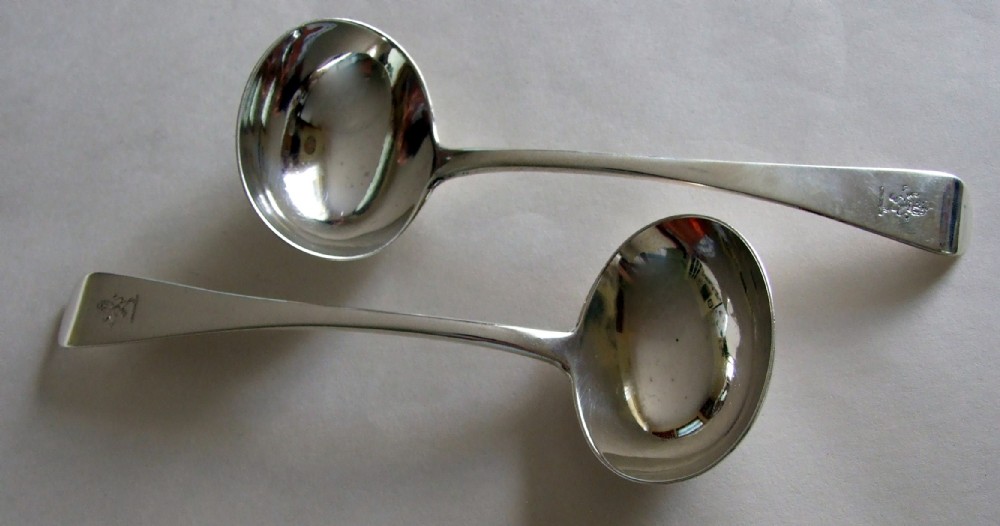 A  pair of George Adams Victorian silver gravy/sauce ladles.