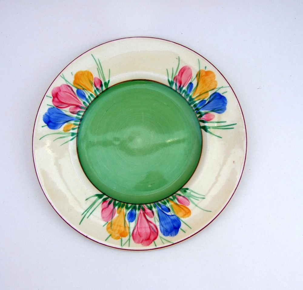 A desirable Clarice Cliffe crocus pattern tea plate.