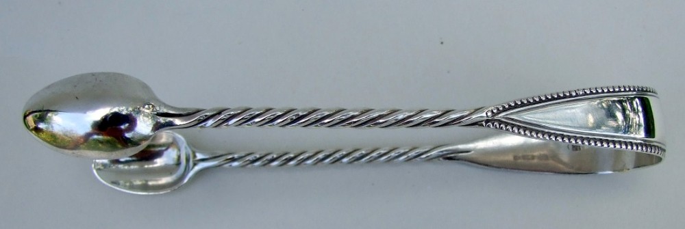 A gorgeous pair of Victorian silver tongs.