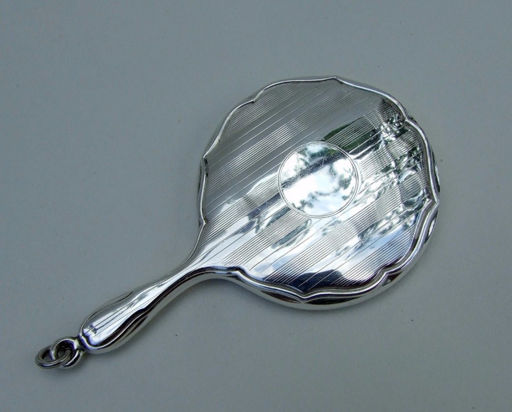 A charming George V silver chatelaine mirror.