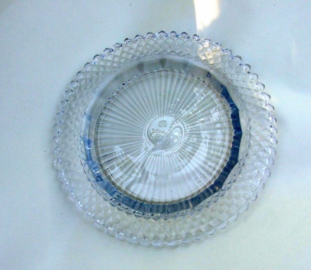 An extremely rare Regency cut glass decanter coaster.