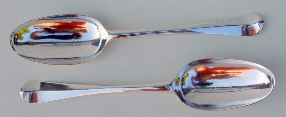 A fabulous pair of George I silver rat-tail serving spoons.