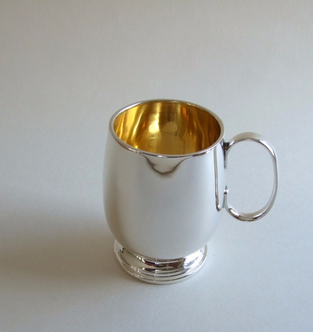 A good quality Edwardian silver gilt Christening mug.