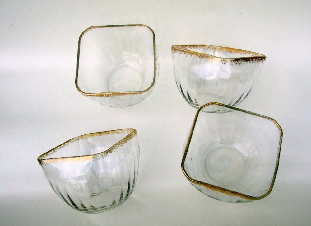 A gorgeous set of four French ribbed and shaped bowls.