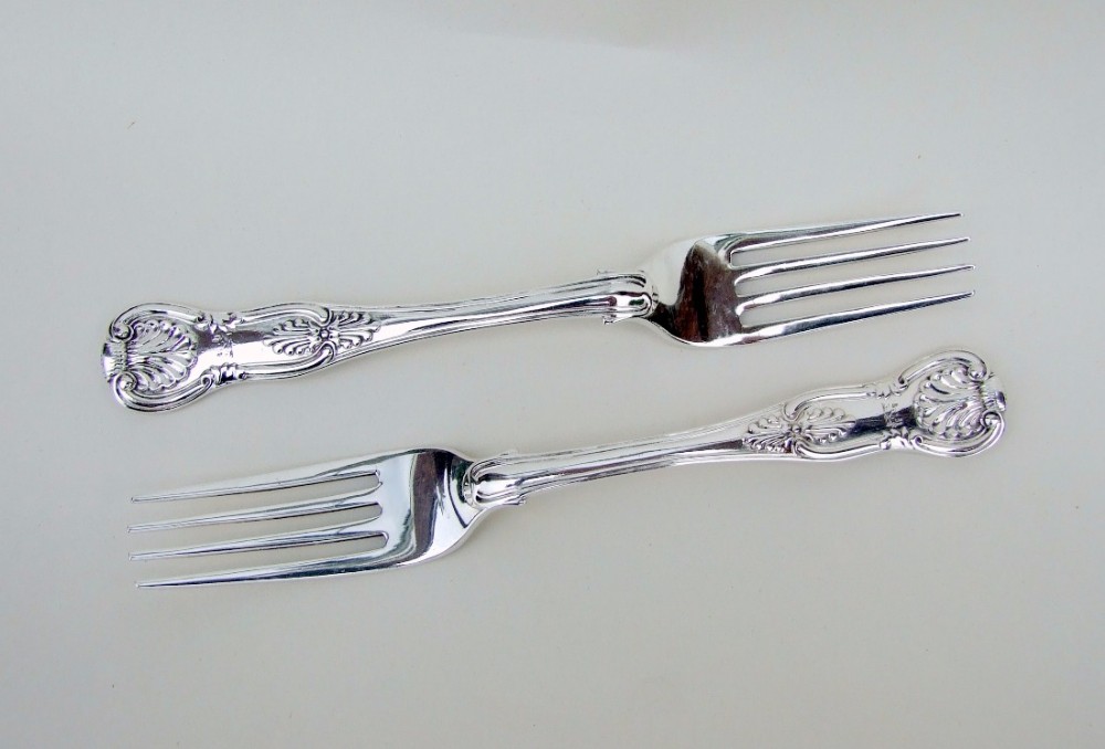 A pair of Exeter silver Kings pattern dessert forks.