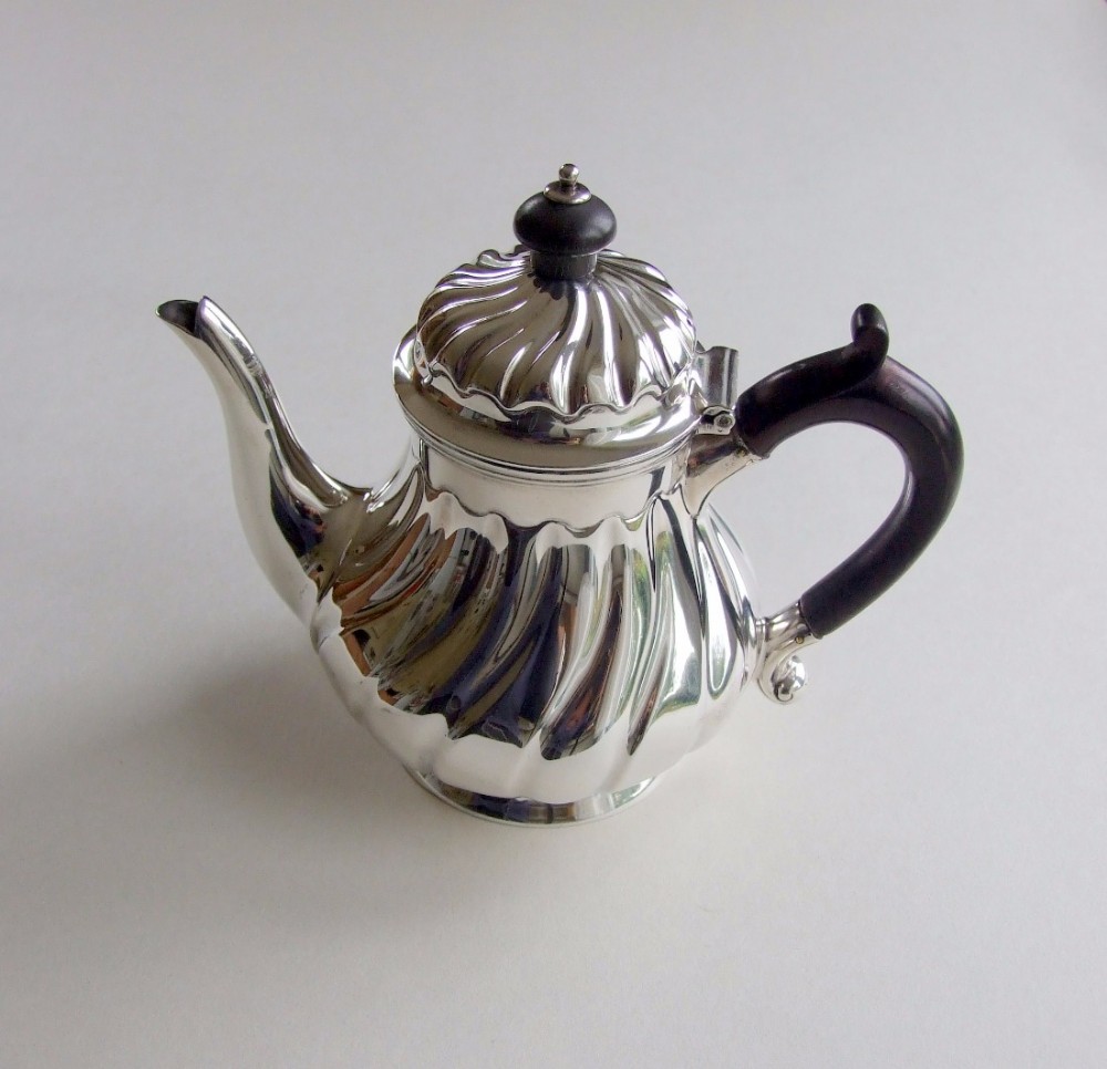 A gorgeous Victorian silver breakfast teapot.