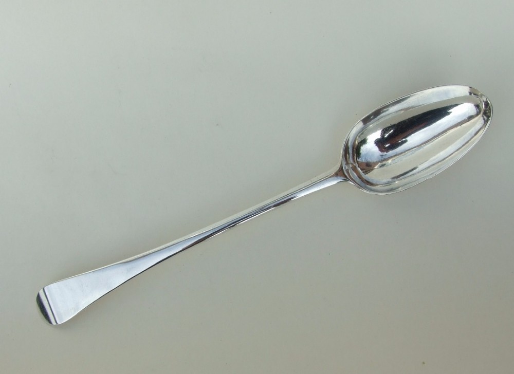 A magnificent George II silver stuffing/basting spoon.