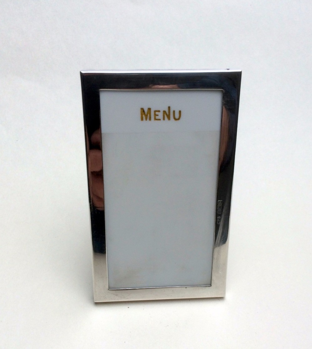 An unusual Edwardian silver table menu.