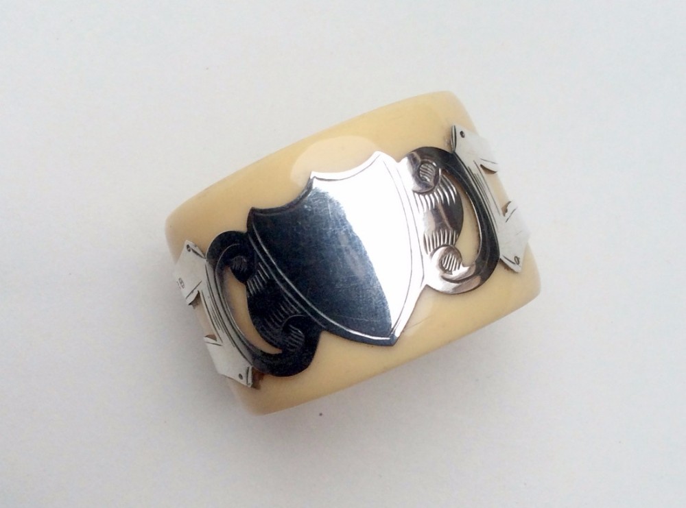 An unusual Victorian silver & ivorine napkin ring.
