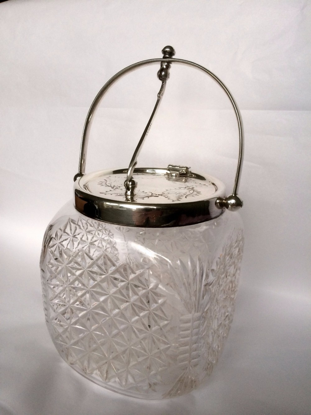 A wonderful holly engraved silver plated biscuit barrel.