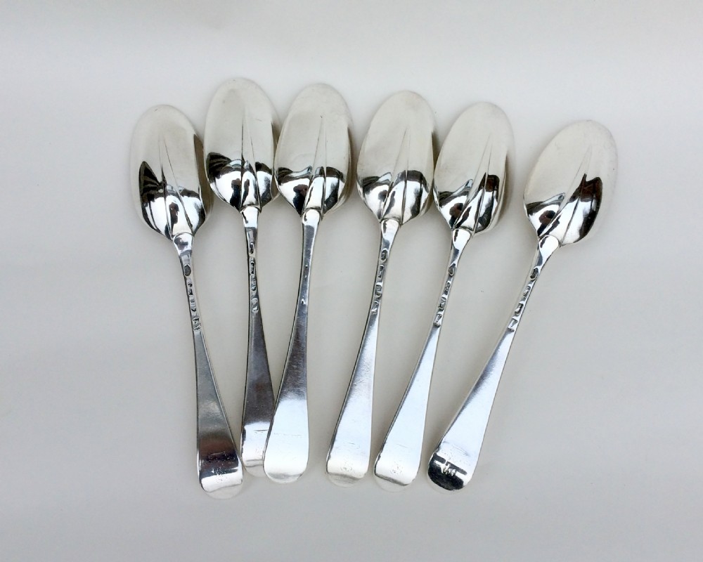 An extremely rare set of six 18th Century rat-tail silver serving spoons