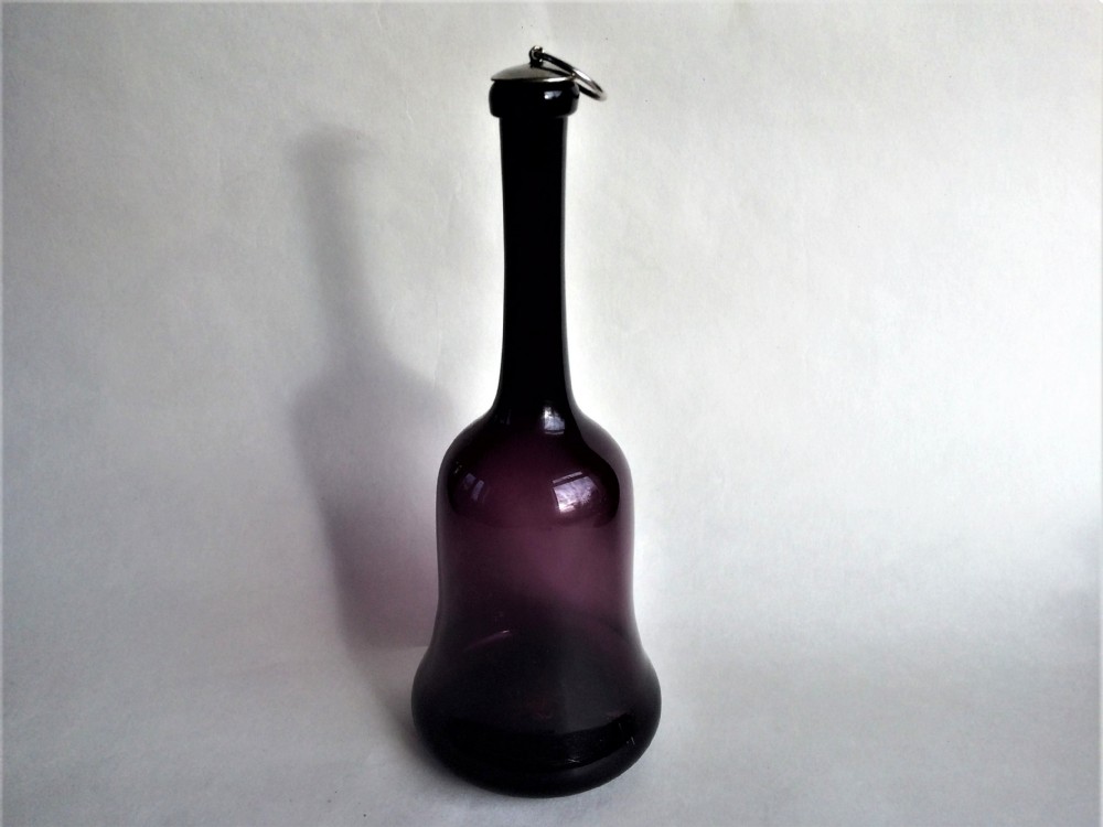 A rare Victorian amethyst liqueur decanter with silver plated cork stopper.