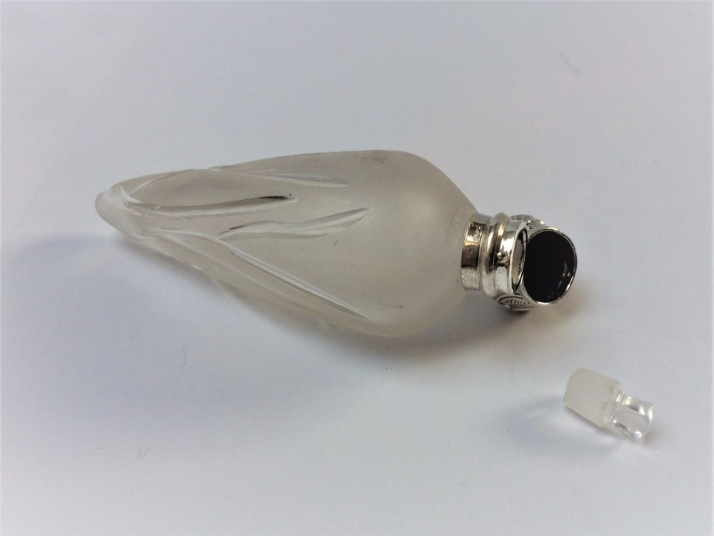 A most unusual silver mounted icicle scent bottle.