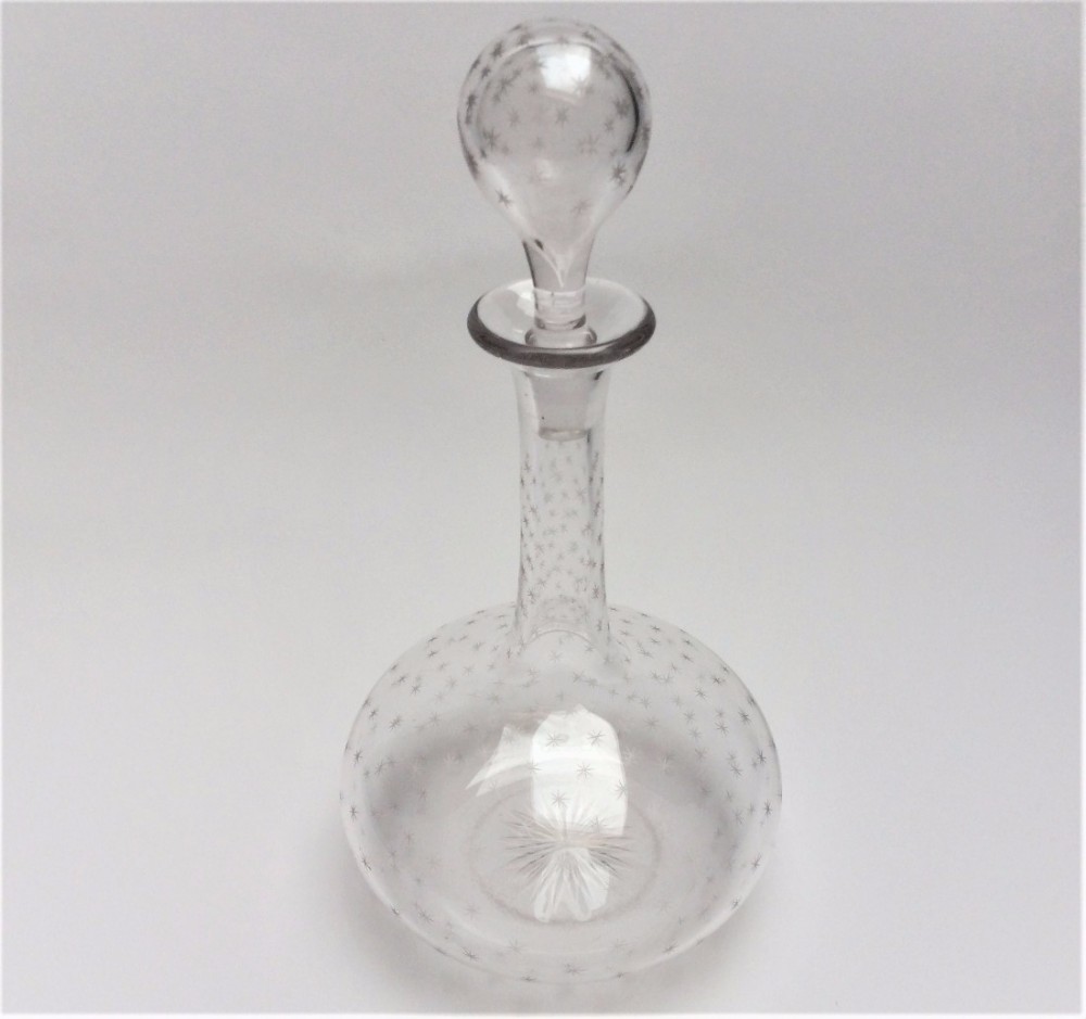 A Victorian star etched globe & shaft decanter.