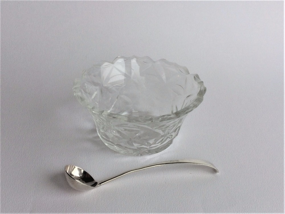 A gorgeous Irish glass condiment dish and silver spoon.